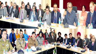 Deputy Chief Minister Dr Nirmal Singh chairing a meeting at Jammu on Monday.