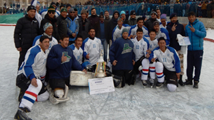 Jubilant ITBP team posing for a group photograph after lifting 10th Ice Hockey Cup at Leh. —Excelsior/Morup Stanzin