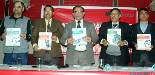 MBD Group top executives releasing a new book during distributors & book sellers meet at Jammu on Sunday.