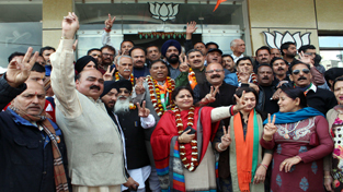 BJP celebrating party’s victory at party headquarters at Trikuta Nagar on Saturday.