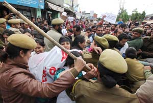 NHM employees holding protest near Press Club Jammu on Thursday. -Excelsior/Rakesh