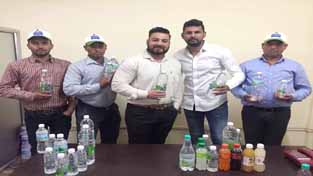Director of M/s Divya Spring Water Enterprises, Akash Dutt alongwith others introducing range of packaged water at Jammu on Thursday.