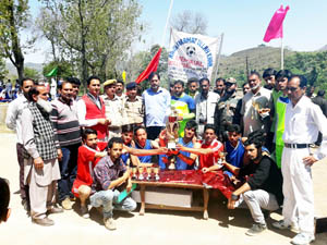Volleyball champion team posing for group photograph with chief guest and other dignitaries at Harni, Mendhar in Poonch.