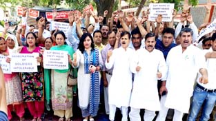 NPP activists staging protest in Jammu on Friday.