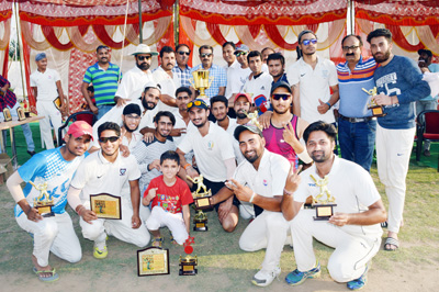 Triumphant JCC players posing for a photograph alongwith Chief Guest Ankush Abrol and Desh Rattan Dubey, Jt Secretary JKCA(J) in Jammu on Sunday.