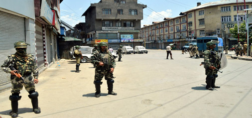 Security personnel patrol a Srinagar locality on Sunday. —Excelsior/Shakeel