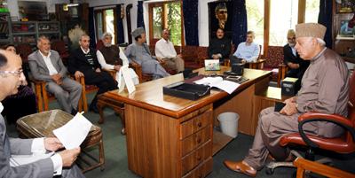 Dr Farooq Abdullah chairing meeting of NC leaders at Srinagar on Saturday.