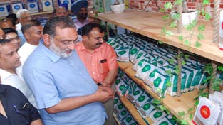 Finance Minister, Dr Haseeb A Drabu looking at products at Organic Store launched by Sarveshwar Group in Jammu. -Excelsior/Rakesh