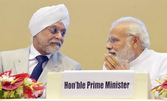 Prime Minister Narendra Modi in conversation with Chief Justice of India, Justice J S Khehar during the inauguration of Integrated Case Management Information System, in New Delhi on Wednesday. (UNI)