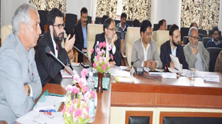 Minister for Revenue, AR Veeri chairing a meeting at Anantnag on Thursday.