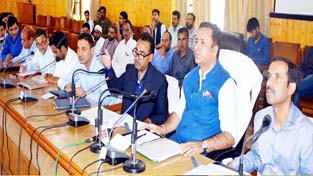 Minister for FCS & CA, Zulfkar Ali chairing a meeting at Baramulla on Sunday.
