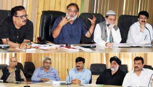 Minister for Finance, Dr Haseeb Drabu chairing a meeting at Srinagar on Monday.
