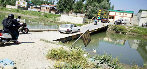 A view of damaged bridge at Bagh-e-Mehtab area of Srinagar.