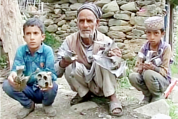 Residents show mortar shells fired by Pakistan army in Balakote sector of Poonch on Tuesday.