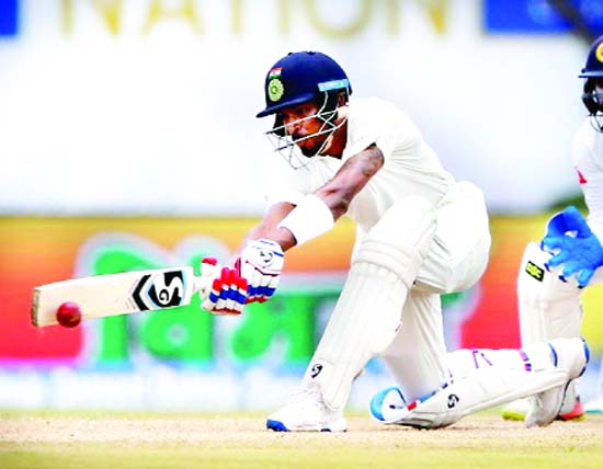 Hardik Pandya sweeps during his knock of 50 runs in his debut Test against Sri Lanka at Galle on Thursday.