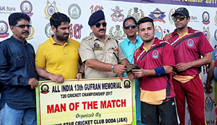 Nazir Ganai, DySP DAR and other dignitaries presenting man of the match award to Gourav Khajuria in Doda on Friday.