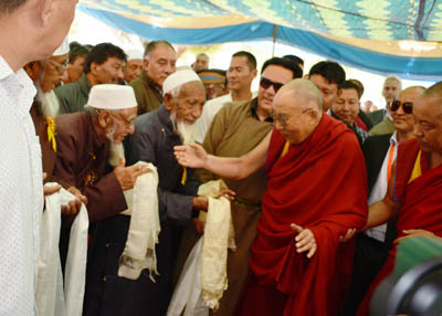 Spiritual leader Dalai Lama being greeted by Muslim community during his visit to Eidgah, Leh. —Excelsior/Morup Stanzin