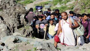 Pilgrims proceedings towards holy cave on Wednesday from Panchtarni. —Excelsior/Sajjad Dar