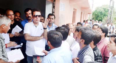 Minister for FCS&CA, Ch. Zulfkar Ali interacting with people at Jagti on Monday.
