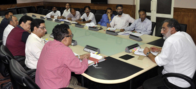 Minister for Finance, Dr Haseeb Drabu chairing a meeting at Srinagar on Wednesday.