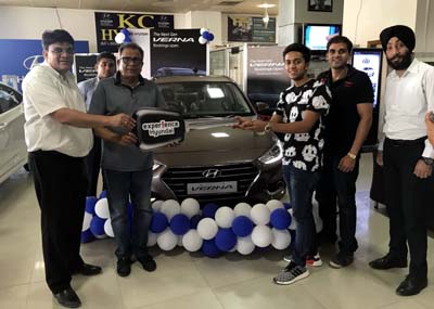 Officials of KC Hyundai presenting the key of Next Gen Verna to a customer at its showroom in Jammu.