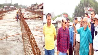R&B Minister Naeem Akhtar inspecting work on Jahangir Chowk-Barzulla flyover on Tuesday.