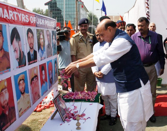 Union Home Minister Rajnath Singh paying floral tributes to martyrs at DPL Anantnag on Sunday.
