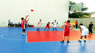 Young players in action during a match of Inter School Basketball Championship at MA Stadium in Jammu