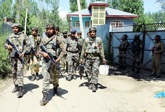 Troops during gun battle with militants at Sopore on Monday. —Excelsior/Aabid Nabi