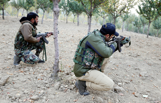 Troops during gunbattle with militants at Handwara on Sunday. —Excelsior/Aabid Nabi