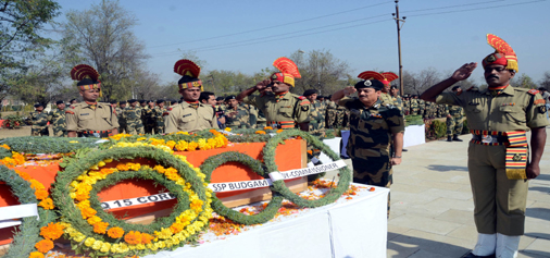 BSF officials paying floral tributes to killed ASI at Humhama in Srinagar on Wednesday. (UNI)