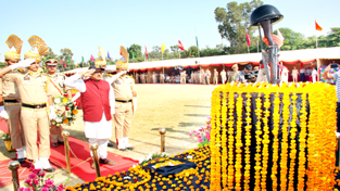 Deputy Chief Minister Dr Nirmal Singh paying tributes to martyrs during Police Commemoration Day function at Gulshan Ground, Jammu on Saturday.
