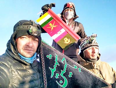Army jawans showing flags after conquering Ladakh’s highest peak Stok Kangri.