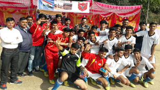 Young footballers posing along with chief guest and other dignitaries at Basohli in Kathua.