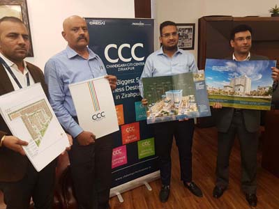 Officials of Chandigarh Citi Center releasing brochure of commercial real estate project at Jammu on Saturday.