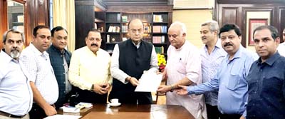 Union Finance Minister Arun Jaitley, in presence of Union Minister Dr Jitendra Singh, receiving a memorandum from a delegation of Federation of Industries Jammu, at North Block, New Delhi on Monday.