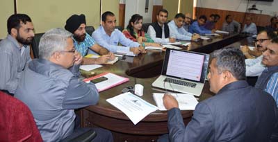 Divisional Commissioner Dr Mandeep K Bhandari chairing a meeting at Jammu on Wednesday.