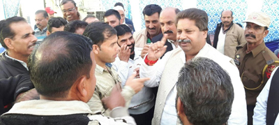 PCC leader Raman Bhalla interacting with people of Bahu Fort in Jammu on Thursday.