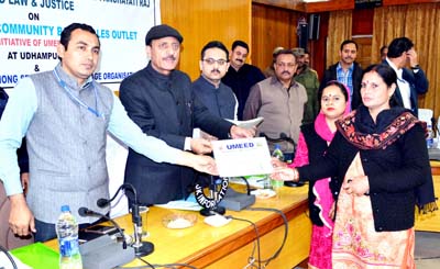 RDD Minister Abdul Haq Khan distributing certificates during a function at Udhampur.