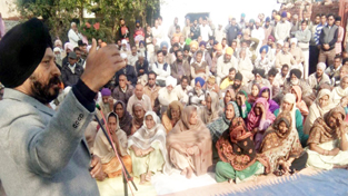 Cong leader Manjit Singh addressing public gathering in Vijaypur on Sunday.