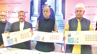 Union Finance Minister Arun Jaitley, flanked by Union Ministers Dr Jitendra Singh and Manoj Sinha, releasing a commemorative postal stamp in the memory of Justice Mehr Chand Mahajan, former Prime Minister of J&K, at India International Centre, New Delhi on Sunday.