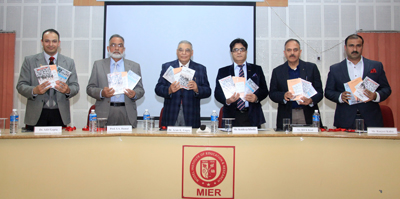 Former DGP Kuldeep Khoda and others launching books at MIER on Tuesday.