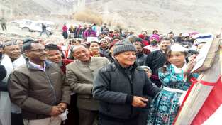 CEC LAHDC Dr Sonam Dawa along with a little girl inaugurating electricity supply to two remote Leh villages.