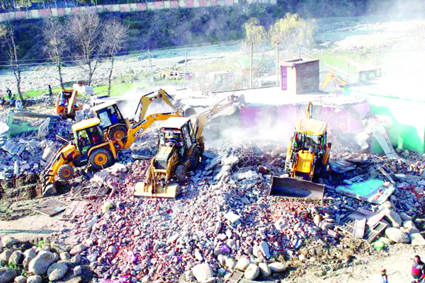 JCBs demolishing structures during major anti-encroachment drive in Rajouri on Saturday. —Excelsior/Bhat