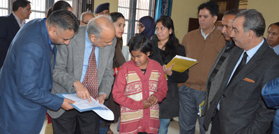 Justice Ali Mohammad Magray interacting with inmate of Children's Home at R S Pura on Wednesday.