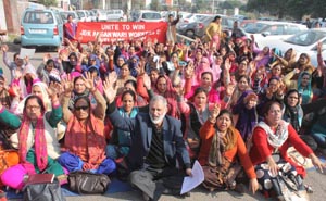 Anganwadi workers and helpers raising slogans during protest at Jammu on Monday. -Excelsior/Rakesh