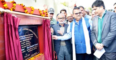 Ministers Naeem Akhtar and C P Ganga launching road upgradation work on Tuesday.