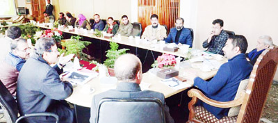 Tourism Minister Tassaduq Mufti chairing a meeting at Srinagar on Monday.