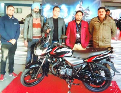 Vineet Aggarwal, Director, Jammu Motors, along with other officials during the launch of all-new Discover 110.