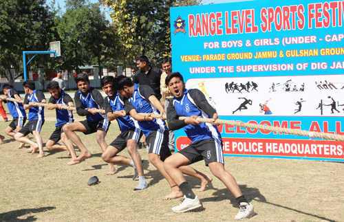 Tug-of War players sweating-it-out during Range Sports Festival at Gulshan Ground in Jammu.